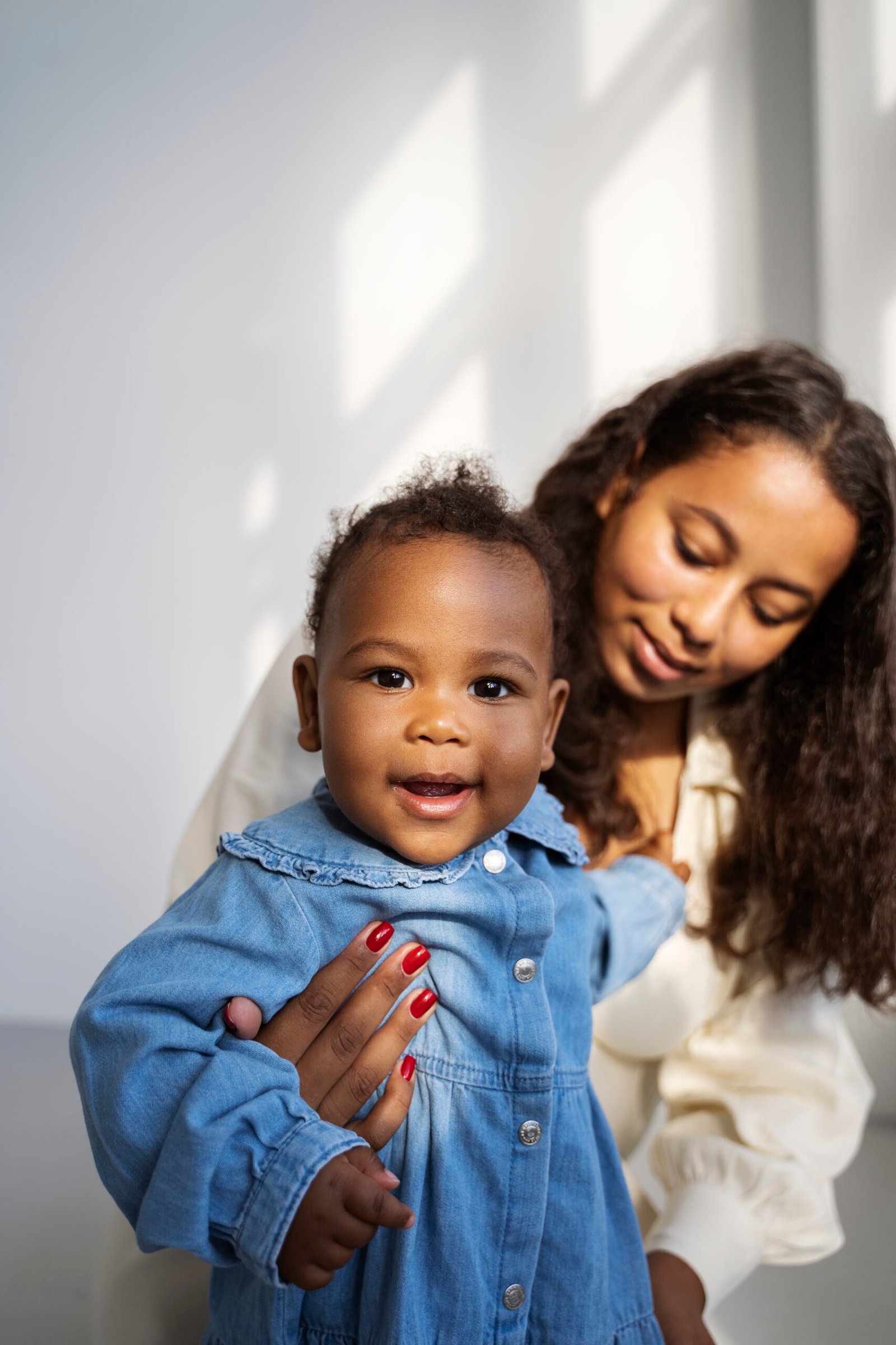 black mother taking car her child scaled.jpg