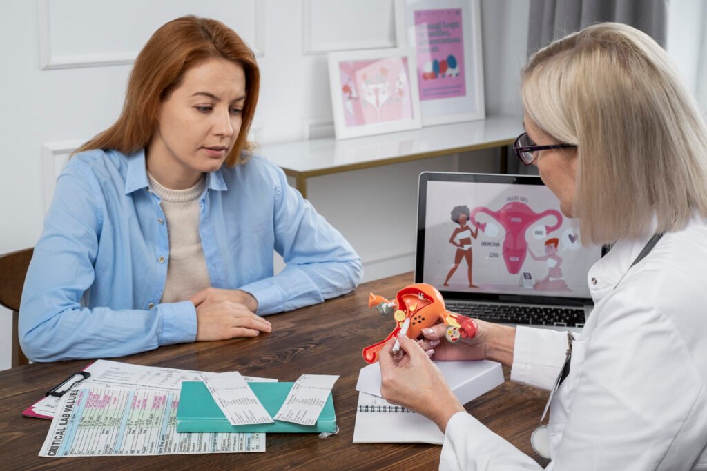 medium shot doctor explaining reproductive system model